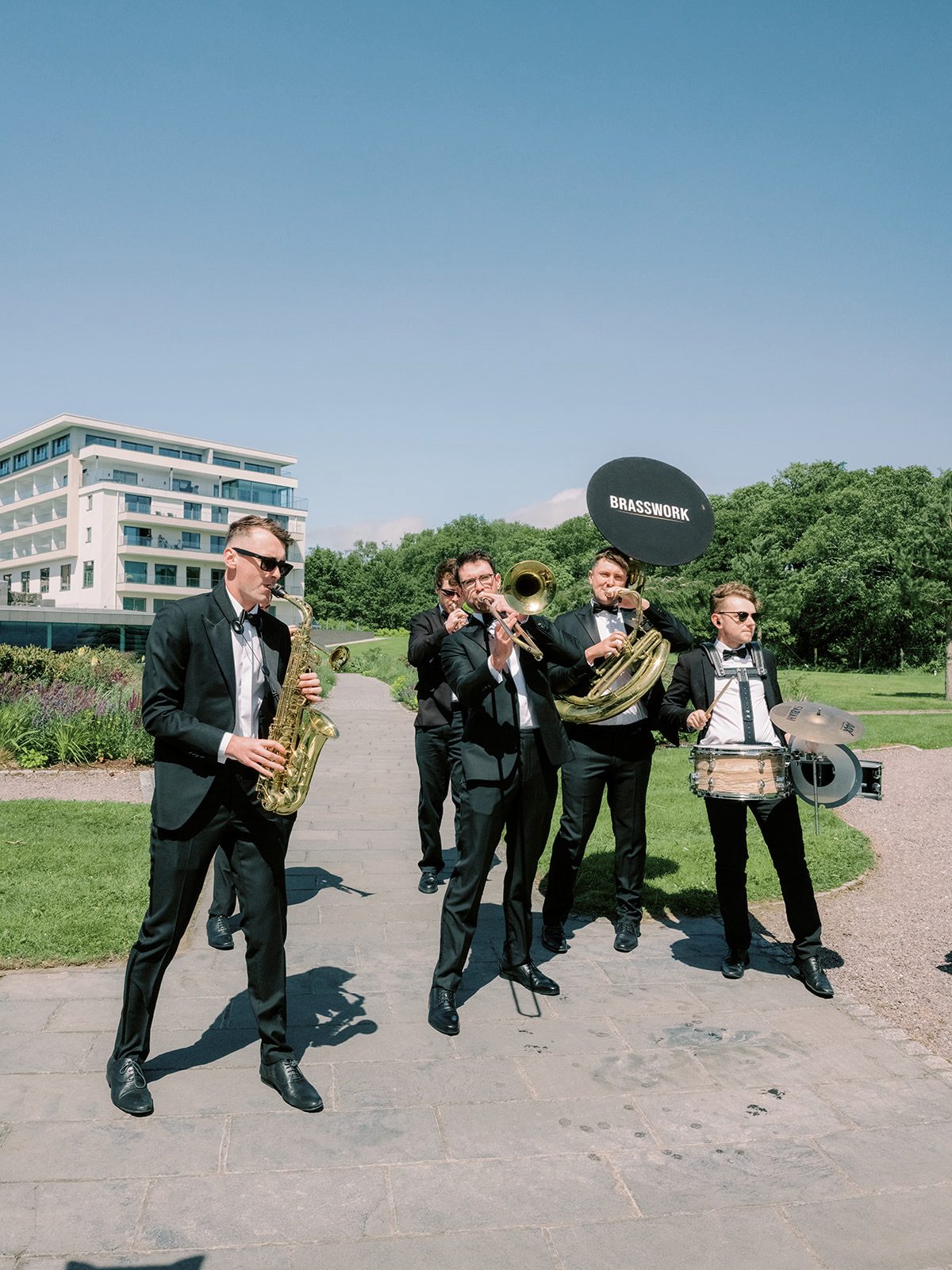 Brasswork six-piece brass band performing in black tie